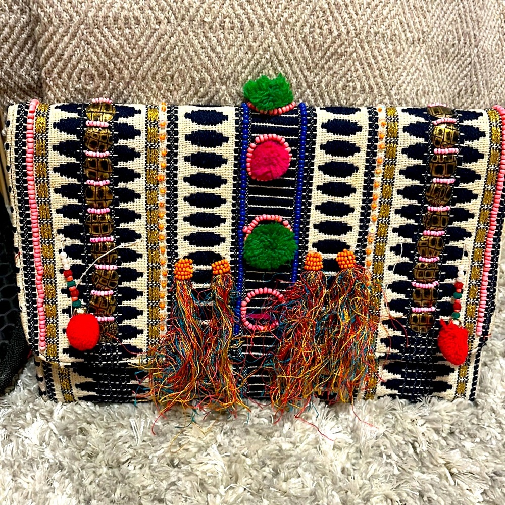 No name brand clutch. Multi color